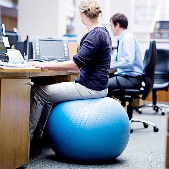 I have lower back pain. Should I seat on a stability ball at the office?